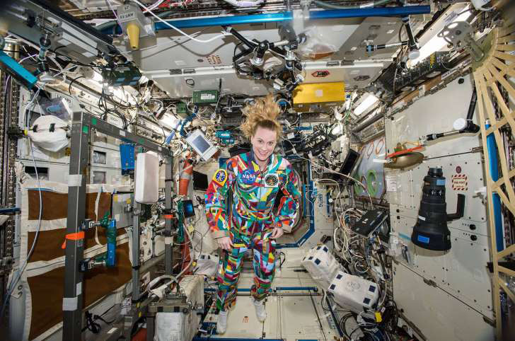 Astronaut Kate Rubins wears suit painted by pediatric cancer patients