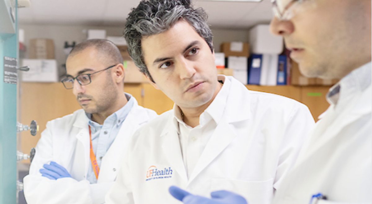 Dr. Elias Sayour with University of Florida Health researchers in the lab
