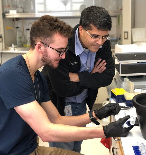 CureSearch-funded researchers working together in a laboratory