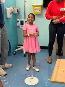 Amari celebrating at the hospital after ringing the bell