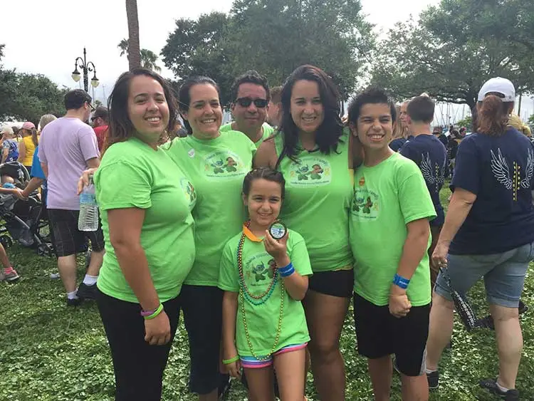Superhero Arianna with her family