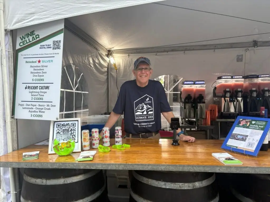Volunteer serving at a fundraiser booth
