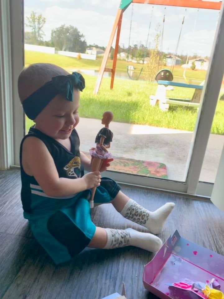 Isabella Rose plays with her Brave Barbie