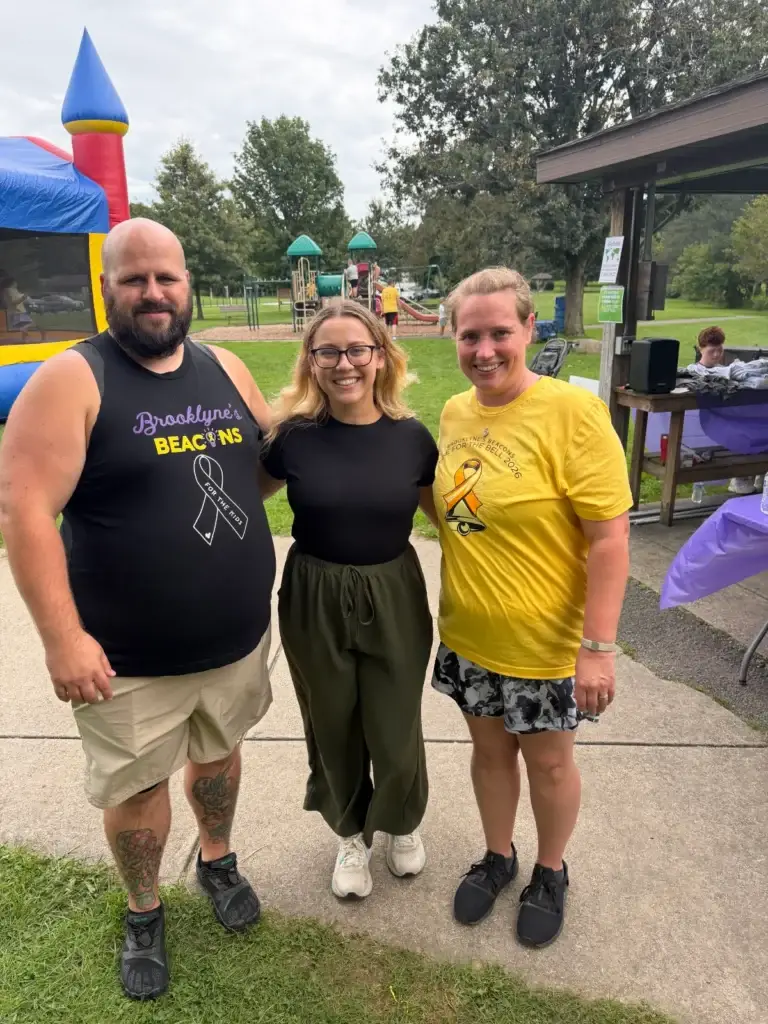 Three supporters at a CureSearch community event