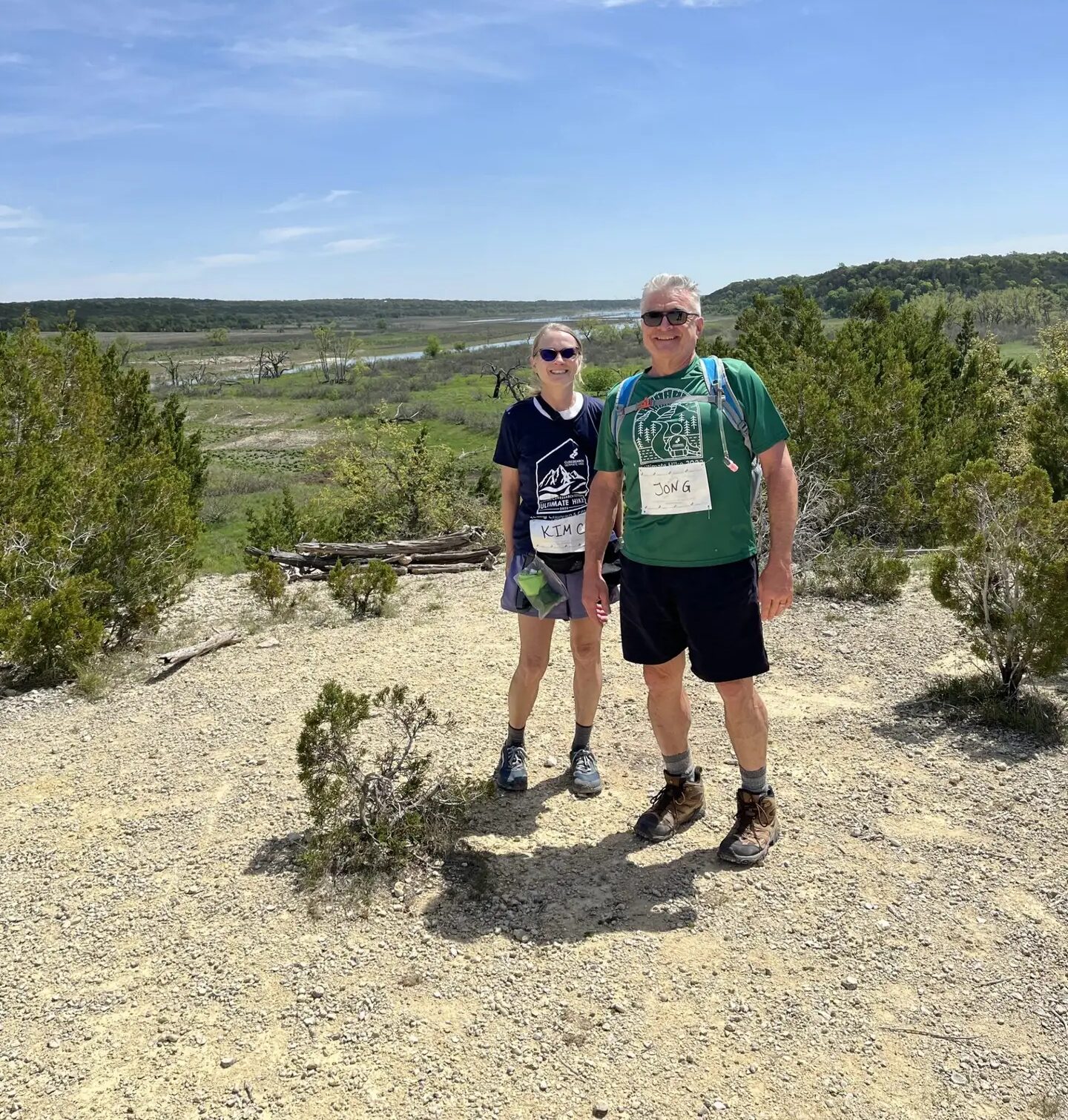 Two Central Texas Ultimate Hike participants overlooking the lake