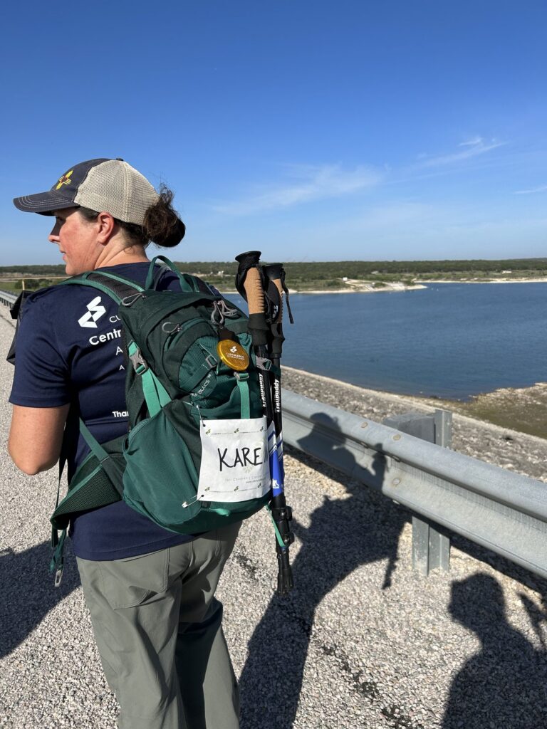 An Ultimate Hike participant on a Central Texas trail overlooking the water